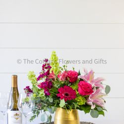 Celebrate their anniversary with "Cheers to Love", a lush and romantic arrangement.