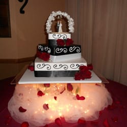 Our Wedding cake exactly as promised. The wedding topper is an heirloom we bought the flowers at King Soopers they put them on