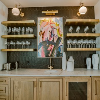 StoneWorks - a kitchen with a marble countertop and open shelvings - General Contractors Near Me - Bluffton, South Carolina StoneWorks - a kitchen with a marble countertop and open shelvings - General Contractors Near Me - Bluffton, South Carolina