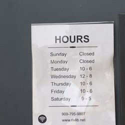 Calimesa Public Library - Library hours posted on front door