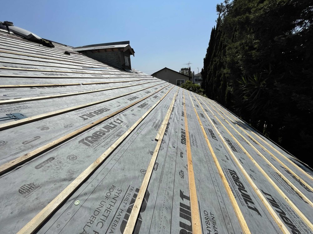 Slide of The Roofing Friend