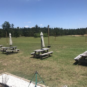 B E Winery - Outdoor seating area, grass area - Wineries Near Me - Conroe, Texas