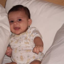 Oxford Suites - Here is my little roommate enjoying mommy's bed. Bed was clean and pillows were super fluffy.