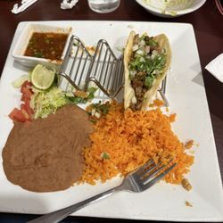 On Fire Bar and Grill - The street tacos were so good. I got chicken, carnitas, and steak. All three were amazing, carnitas were my favorite. The rice was amazing.