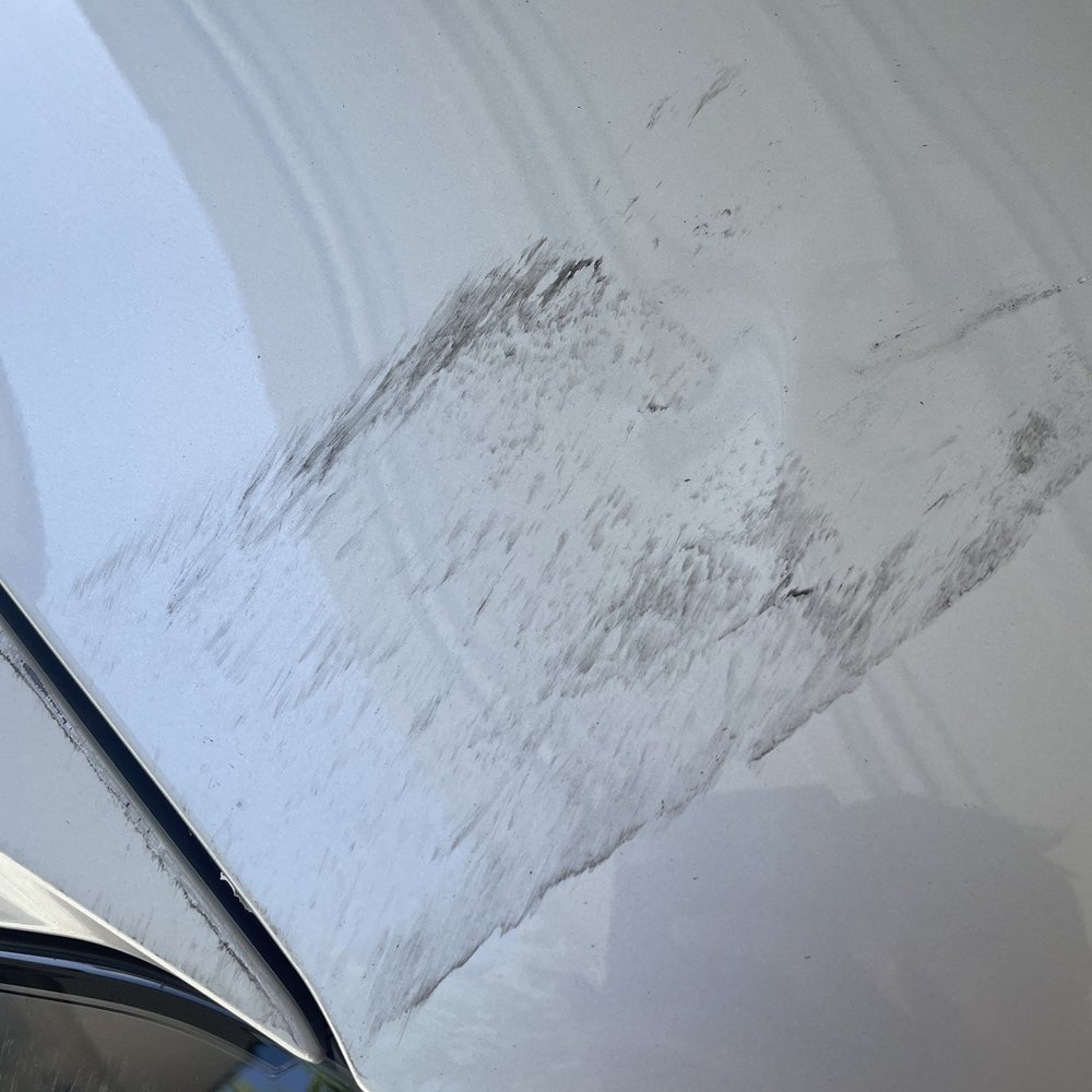BEFORE: Scratches on hood
