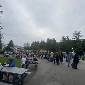 Bank NH Pavillion - a large group of people walking through a park - Music Venues Near Me - Gilford, New Hampshire Bank NH Pavillion - a large group of people walking through a park - Music Venues Near Me - Gilford, New Hampshire