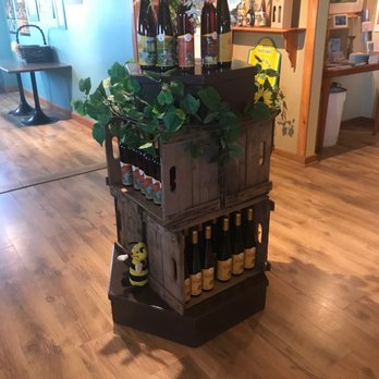 Hydromellerie - a display of wine bottles and flowers - Specialty Food Near Me - Saint-Paul-de-la-Croix, Quebec