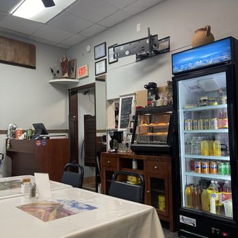 La Tia Peruvian Cuisine - The back of restaurant- entrance to kitchen.  Drinks at bottom are Tamarindo & Passion Fruit made in house! Plus pastries & other yums! - Peruvian Near Me - Atlantic City, New Jersey