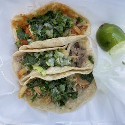Rigo's Taqueria - Mexican style street tacos (with chicken, onion, cilantro, lime).