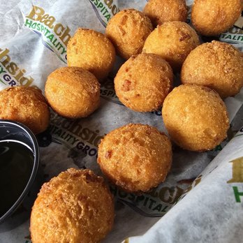 Crabby's Oceanside - Hush Puppies. Served with honey. - Seafood Near Me - Daytona Beach, Florida
