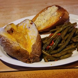 Green beans, loaded baked potato with butter, cheese, & bacon (I held the sour cream), and garlic bread Green beans, loaded baked potato with butter, cheese, & bacon (I held the sour cream), and garlic bread