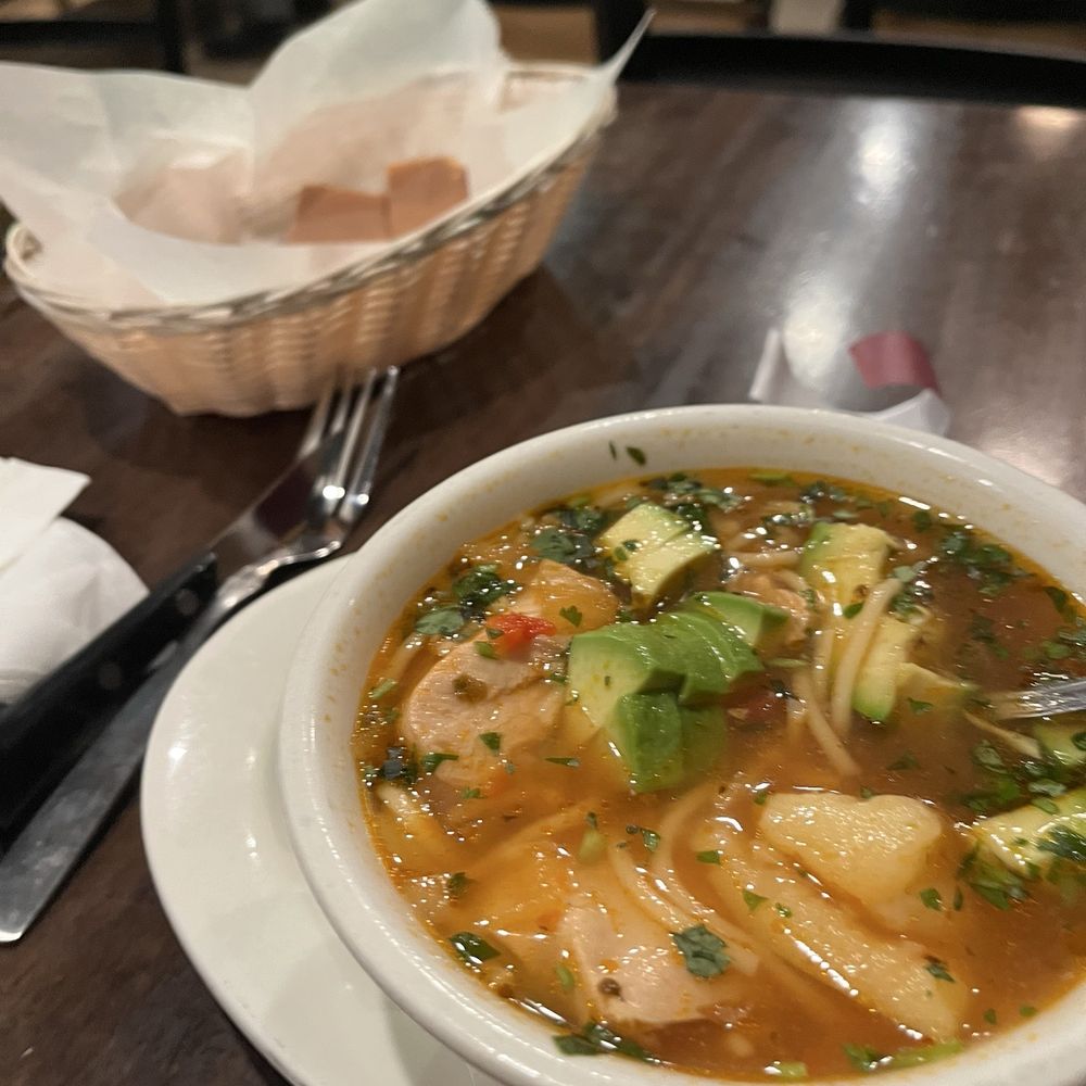 Chango Kitchen - Chicken noodle soup with avocado and Cuban bread warmed. - Latin American Near Me - Hoboken, New Jersey Chango Kitchen - Chicken noodle soup with avocado and Cuban bread warmed. - Latin American Near Me - Hoboken, New Jersey