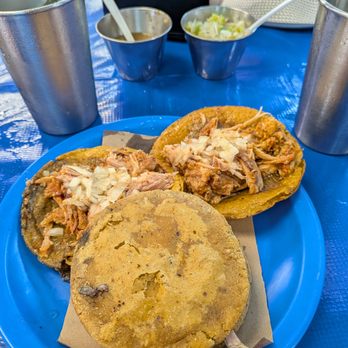 Taquería La Lupita - Cochinita Pibil Panuchos partially eclipsed by a Polcan - Tacos Near Me - Mérida, YUC