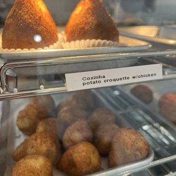 Brazuca Cafe - Plenty of small snacks in the case to grab and go or sit and eat. Highly recommend their sandwiches too. - Brazilian Near Me - Costa Mesa, California