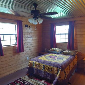 Redawg Ranch - The bedroom with its queen size, memory foam mattress will comfortably sleep two adults. - Vacation Rental Agents Near Me - Seguin, Texas