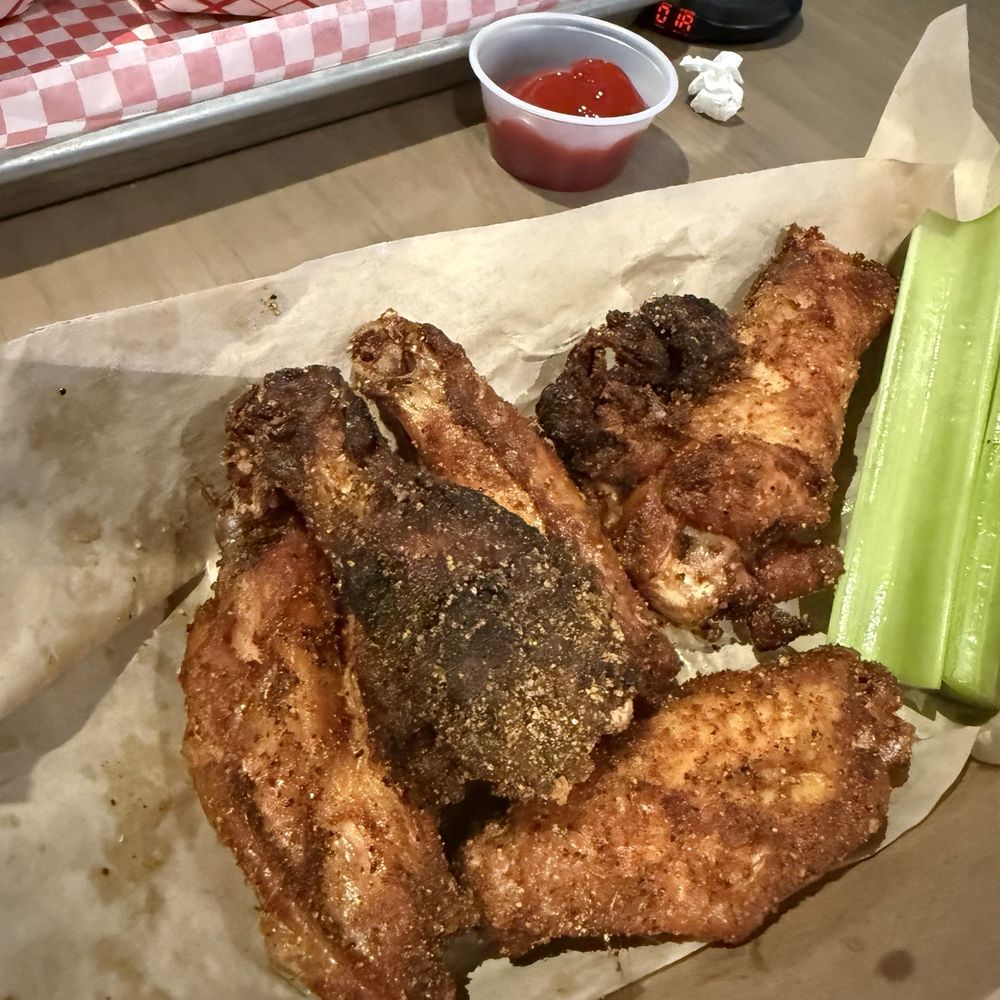 Bristol's Burgers, Beef & BBQ Restaurant and Sports Bar - On order of wings - very burnt and crispy piece - Sports Bars Near Me - Mesa, Arizona Bristol's Burgers, Beef & BBQ Restaurant and Sports Bar - On order of wings - very burnt and crispy piece - Sports Bars Near Me - Mesa, Arizona