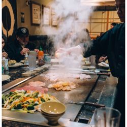 Shirasoni Japanese Sushi & Steakhouse - He is cooking our chicken, shrimp, and steak.