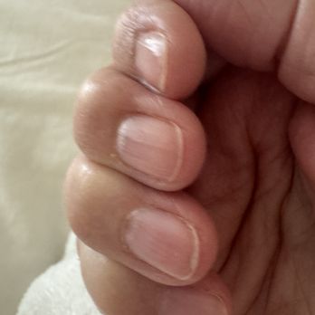 Milano Nail Spa Galleria - Shortest nails ever!  P. S.  That's a WOMAN's hand! - Nail Salons Near Me - Houston, Texas