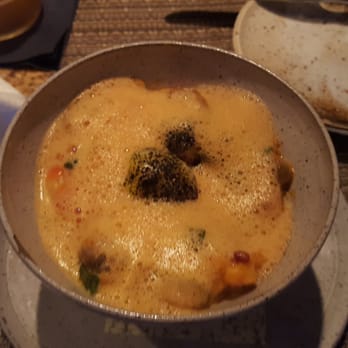Husk - Lobster bisque foam atop shrimp and grits with soft boiled egg yolk - Southern Near Me - Nashville, Tennessee