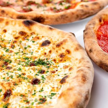 Rally Pizza - three pizzas on a table - Pizza Near Me - Vancouver, Washington Rally Pizza - three pizzas on a table - Pizza Near Me - Vancouver, Washington