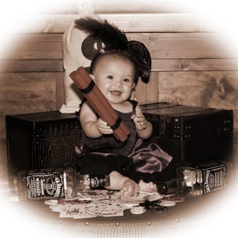 TNT Old Time Photo - Branson's own little baby Saloon girl in training! Watch out she is slinging dynamite! We take pride in capturing moments to cherish forever - Session Photography Near Me - Branson, Missouri