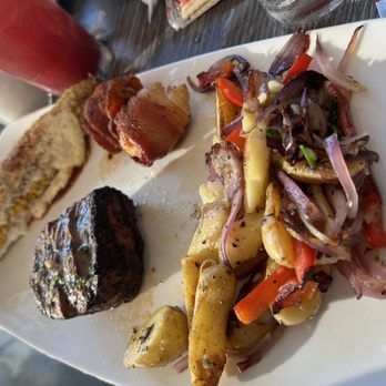 Salt Cracker Fish Camp - Surf and turf street corn,bacon wrapped scallops,fillet and fingerling potatoes with onions and peppers. Oh and sangrias 2for10 - Seafood Near Me - Clearwater, Florida