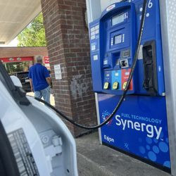 Exxon - The New Jersey gas attendant is enjoying some sights while he looks away