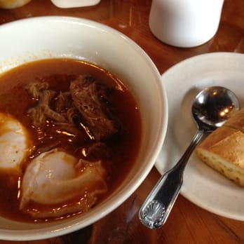 Ria's Bluebird - Beef brisket stew with poached eggs - Southern Near Me - Atlanta, Georgia Ria's Bluebird - Beef brisket stew with poached eggs - Southern Near Me - Atlanta, Georgia