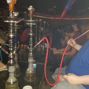 Hookah Springs Cafe - a woman smoking a hookah - Hookah Bars Near Me - Colorado Springs, Colorado Hookah Springs Cafe - a woman smoking a hookah - Hookah Bars Near Me - Colorado Springs, Colorado