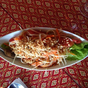 Noi Thai - a plate of food on a table - Thai Near Me - Edmonton, Alberta Noi Thai - a plate of food on a table - Thai Near Me - Edmonton, Alberta