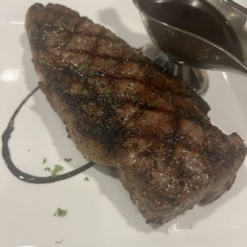 1818 Chophouse - New York strip 16 ounce cut. Properly priced properly seasoned properly prepared! I prefer the AU JUS to enhance the flavor. - Seafood Near Me - Edwardsville, Illinois