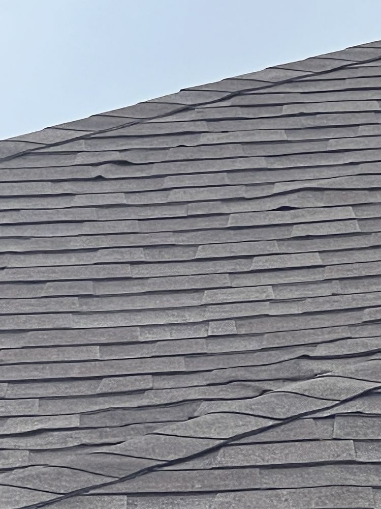 Slide of Tucker Roofing Systems