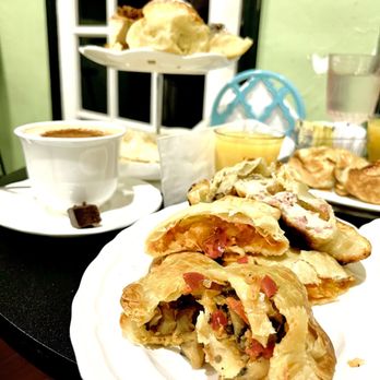 Cafe Paris Garden - Mushroom mix and pumpkin corn empanada. Mushroom mix is flavored with pepper and tomatoes, a true gem. - Cafeteria Near Me - Miami Beach, Florida Cafe Paris Garden - Mushroom mix and pumpkin corn empanada. Mushroom mix is flavored with pepper and tomatoes, a true gem. - Cafeteria Near Me - Miami Beach, Florida