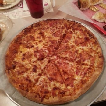 Tony's Pizza Palace - a cheese pizza on a pan - Pizza Near Me - Smithfield, Rhode Island