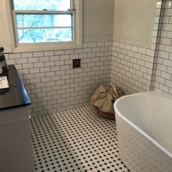Balance Construction - a bathroom with a black and white checkered floor - General Contractors Near Me Balance Construction - a bathroom with a black and white checkered floor - General Contractors Near Me