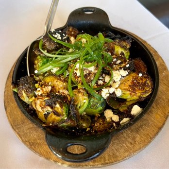 Extra Virgin - Fire roasted Brussels sprouts with cherry pomegranate vinaigrette, barberries, dukka, and feta cheese - Tapas/Small Plates Near Me - Kansas City, Missouri