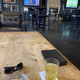 Sitting inside on a windy day enjoying a cigar Sitting inside on a windy day enjoying a cigar