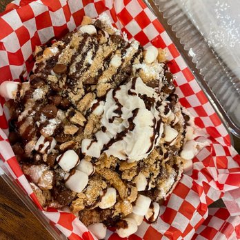 Funnel Me Crazy - S'mores Powdered sugar, chocolate chips, marshmallows, graham Cracker pieces, chocolate sauce. - Desserts Near Me - Durham, North Carolina
