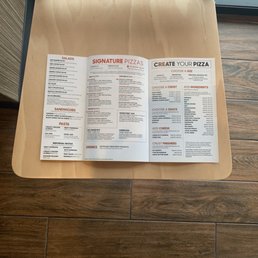 a menu on a table in a restaurant
