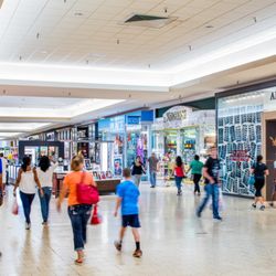 NorthPark Mall - Shoppers walk through NorthPark Mall past American Eagle Outfitters.