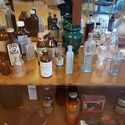 Custom Med Apothecary - Neat display of antique apothecary equipment.