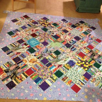 Bear Paw Quilts & More - Mitered corners in this floral fantasy turned out well thanks to he owners help! - Fabric Stores Near Me - Oakhurst, California