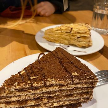 Uyghur Eats - a slice of cake on a plate - Noodles Near Me - Washington, DC, District of Columbia