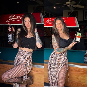 Captain's Anchor - a woman holding a bottle of beer - Bars Near Me - Stockton, California