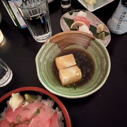 a plate of sushi and a bowl of rice a plate of sushi and a bowl of rice