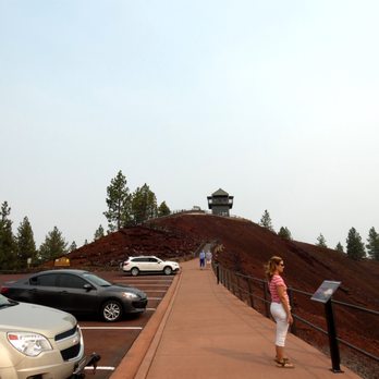 Lava Lands Visitor Center - Lava Butte parking lot on a smokey day - Visitor Centers Near Me - Bend, Oregon Lava Lands Visitor Center - Lava Butte parking lot on a smokey day - Visitor Centers Near Me - Bend, Oregon