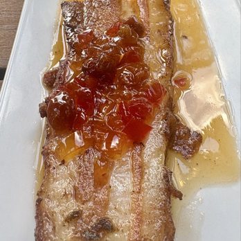 Barcelona Wine Bar - Pork Belly with a tasty red pepper sauce on top - Tapas/Small Plates Near Me - Raleigh, North Carolina