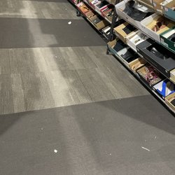 DSW Designer Shoe Warehouse - Trash everywhere. Floor is so disgusting.