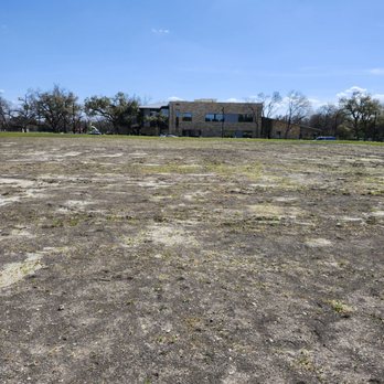 Cedar Park Public Library - That building way in the distance. That's the library from out parking spot. One of the few drawbacks. We cut across this field - Libraries Near Me - Cedar Park, Texas