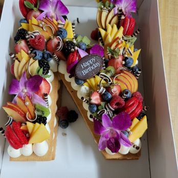 Frudeco - Medium side alphabet cake with vanilla filling. With fresh fruits and flowers. - Desserts Near Me - Miami, Florida Frudeco - Medium side alphabet cake with vanilla filling. With fresh fruits and flowers. - Desserts Near Me - Miami, Florida